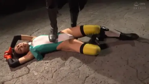 Futuristic Asian Duo in Sci-Fi Costumes