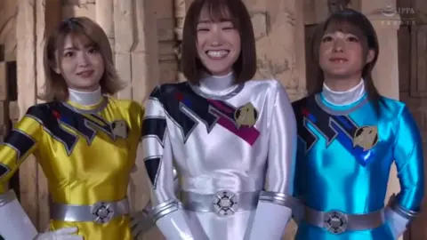 Glamorous Costume Models Posing with Guns