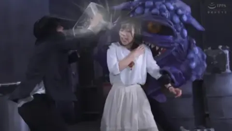 Asian Costumed Performers in Industrial Setting