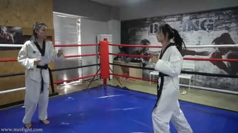 Asian Lesbians Grappling in Martial Arts Gym