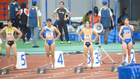 Asian Girls Running on Track