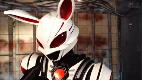 Asian Performers in Futuristic Costumes