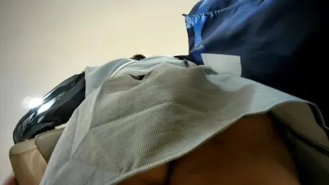Asian Man Masturbates in Clothing Store