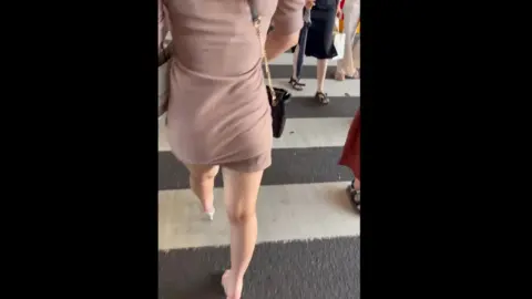 Asian Woman in High Heels Walking Outdoors