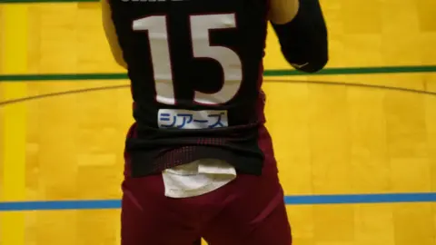 Asian Volleyball Players in Action