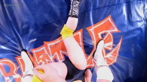 Asian Wrestlers Engage in Intense Matches