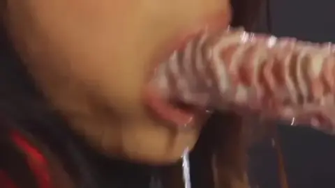 Dark-Haired Woman in Red Mask Bondage and Fetish Play