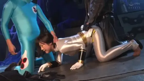 Three Asian Women in Costumes Engage in Intimate Encounter