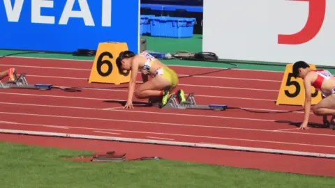 Asian Athletes Compete on Track