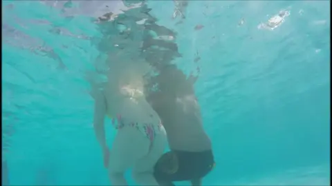Underwater Swimwear Scene with Blonde and Brunette