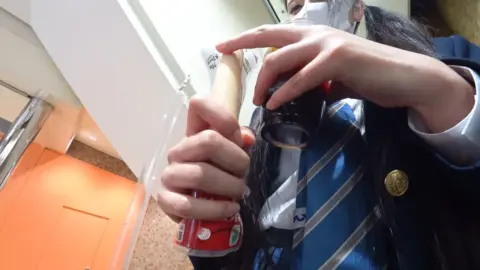 Asian Teen in School Uniform Exposes Underwear