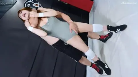 Asian Couple Wrestling in Ring