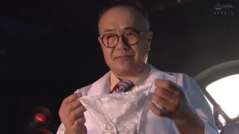 Costumed Woman Being Carried and Posing with Men