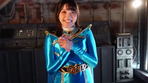 Asian Woman in Industrial Setting