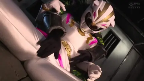 Asian Couple in Silver Costume Industrial Seduction