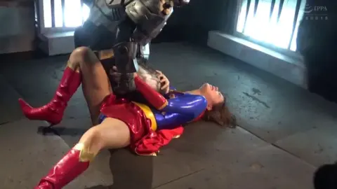 Woman dominated on ground and black cloth