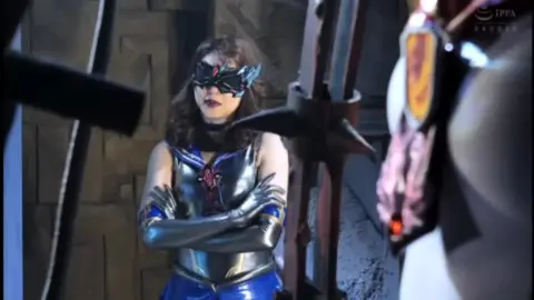 Futuristic Asian Beauty in Metallic Bondage