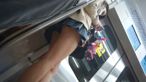 Asian Teen in Plaid Skirt on Train