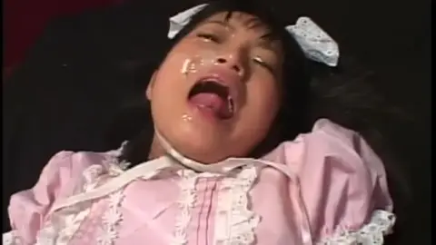 Asian Teen in Pink Dress on Bed