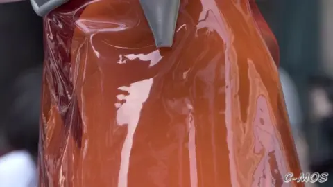 Asian Girl Undresses on Rainy Street