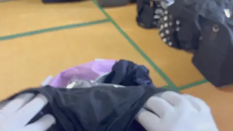 Bald Woman in White Gloves with Mickey Print