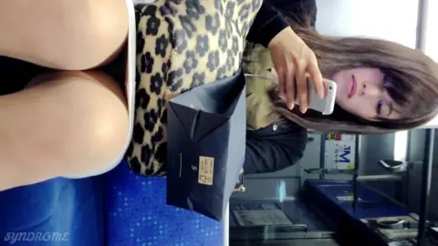 Asian Teen in Leopard Skirt on Public Transportation