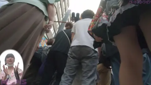 Women Talking on Phone, Walking Away