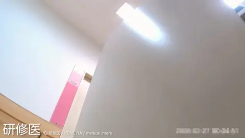 Asian teen in white stockings on medical chair