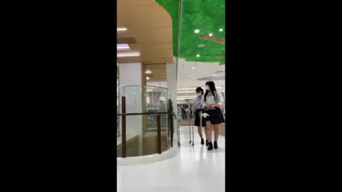 Asian Schoolgirls in Shopping Mall