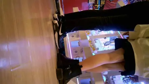 Asian Girls in Erotic Poses at Arcade