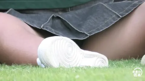 Asian Girls Relaxing in Denim Skirts Outdoors