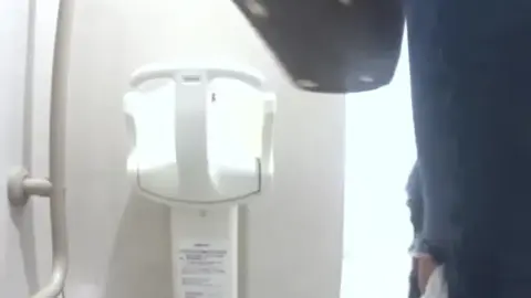 Asian Girl Urinating in Bathroom