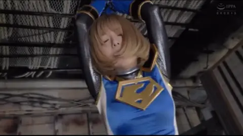 Asian Blonde in Blue Costume Restrained in Industrial Setting