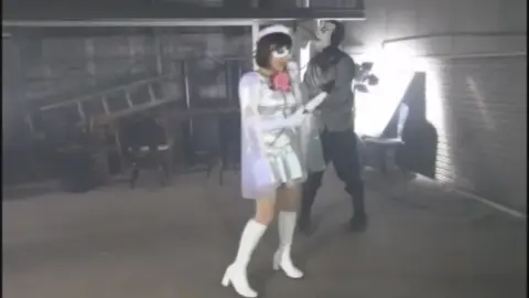 Asian Schoolgirls Dance in Raincoat and Boots