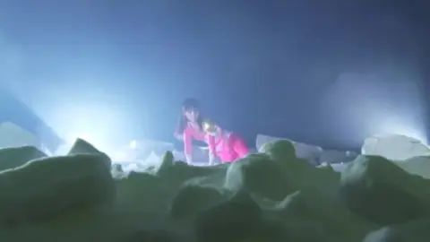 Asian Performer in Fantasy Costumes