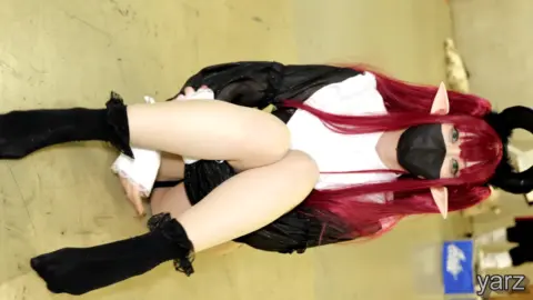 Asian Cosplayer in Devil Costume