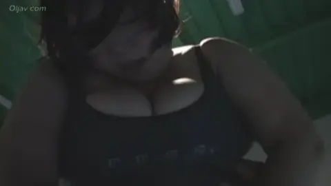 Asian Wrestling Match with Plus-Sized Performer