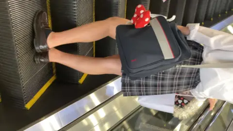 Asian Schoolgirls on Escalator