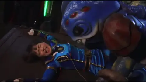 Asian Girl in Costume Fights Monster in Dark Room