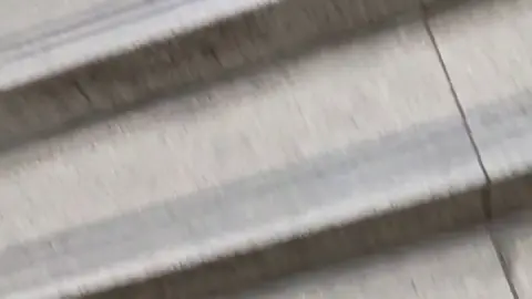 Blonde Asian Girl on Escalator