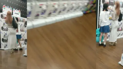 Asian Blonde in Long Dress at Store