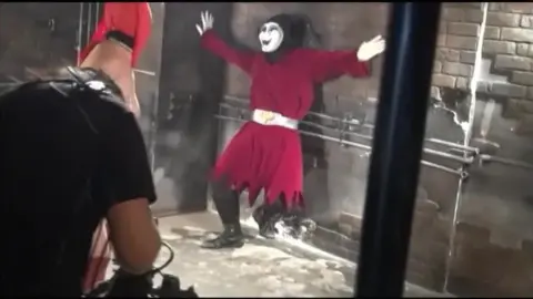 Industrial Fetish Scene with Red Mask