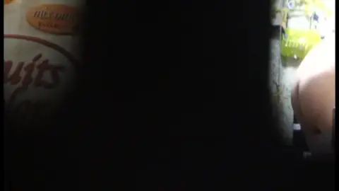 Blonde Teen in Cluttered Room