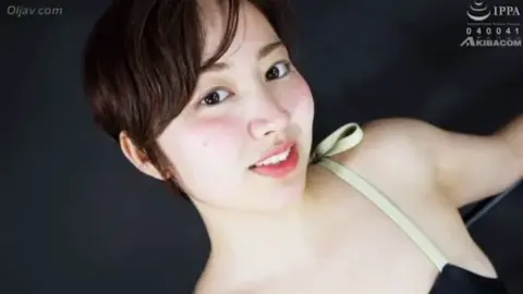 Asian Couple Intimate Bedroom Encounter