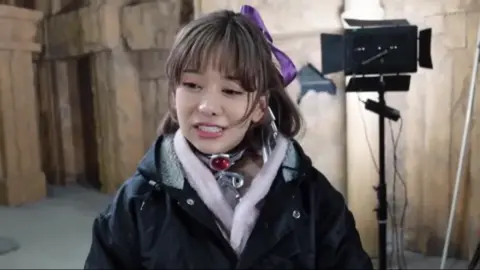 Asian Cosplay Lovers in Temple Setting