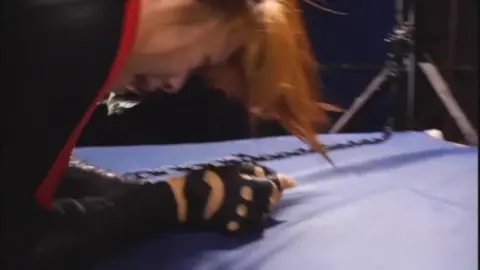 Asian Couple in Leather Outfit BDSM Scene