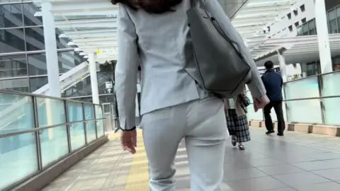 Asian Businesswoman in Grey Suit