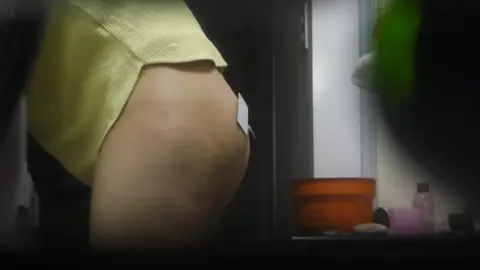 Sexy Girl Lifting Shirt and Playing with Phone