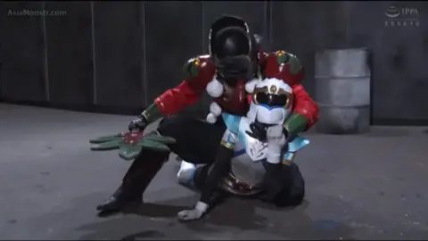 Asian Women in Costumes Fighting in Warehouse