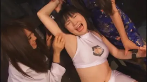 Asian Girls Dancing and Playing in Nightclub